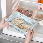 Adjustable refrigerator storage drawer basket